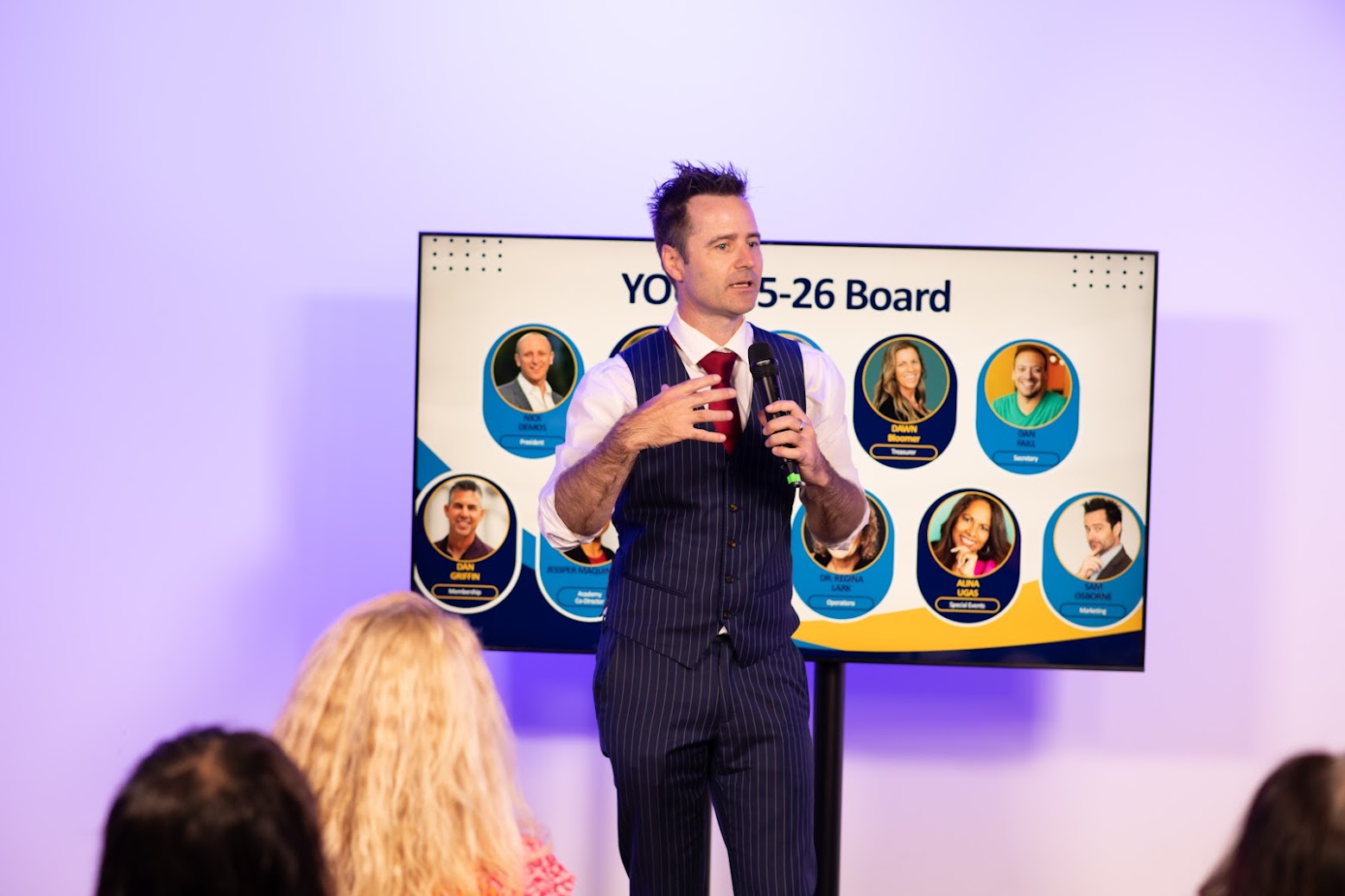Sam Osborne leading a panel discussion overlooking the Los Angeles skyline